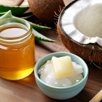 **

*   Prompt: Close-up shot of various natural skincare ingredients laid out on a wooden table. Include aloe vera leaf, coconut oil in a jar, and a small bowl of honey. Soft, natural lighting. Focus on highlighting the textures and colors of the ingredients.

**